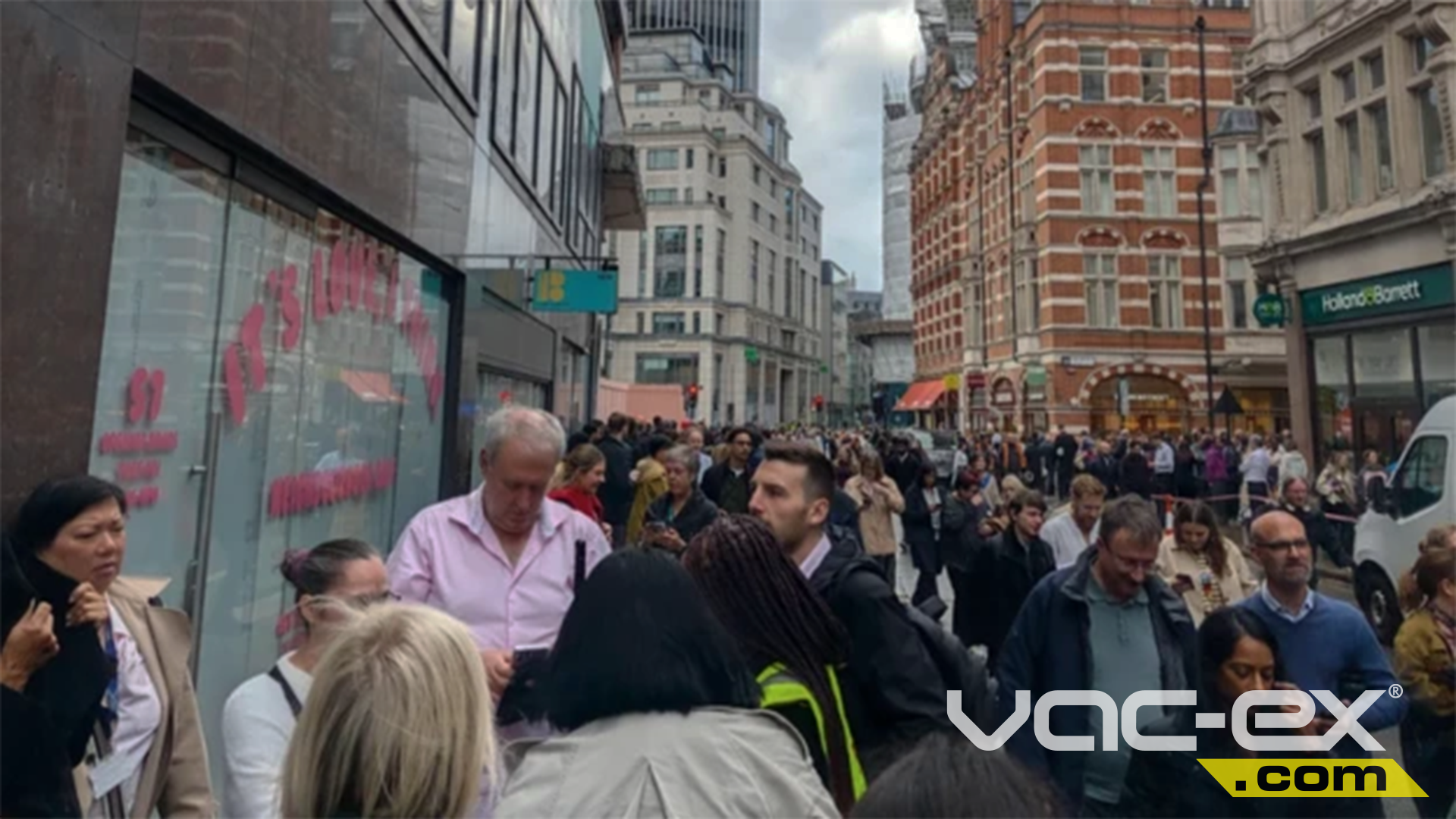 People gathered on a street in the City of London